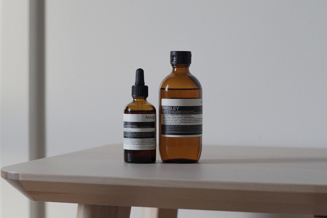 a bottle of lotion and a bottle of lotion sitting on a table