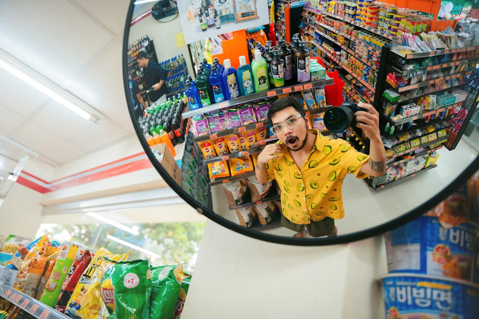 Playful selfie reflection in a convenience store mirror capturing colorful aisles and products.