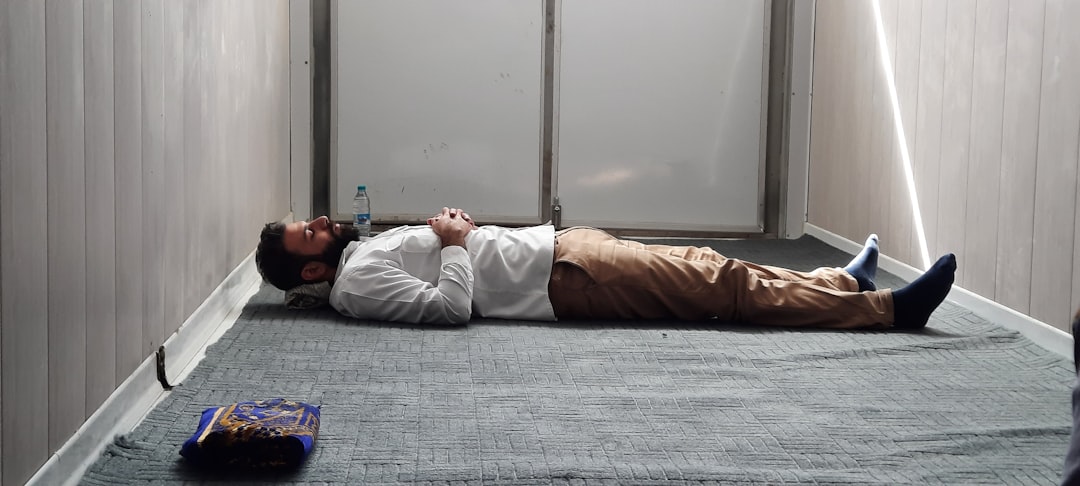 a man laying on the floor in a room