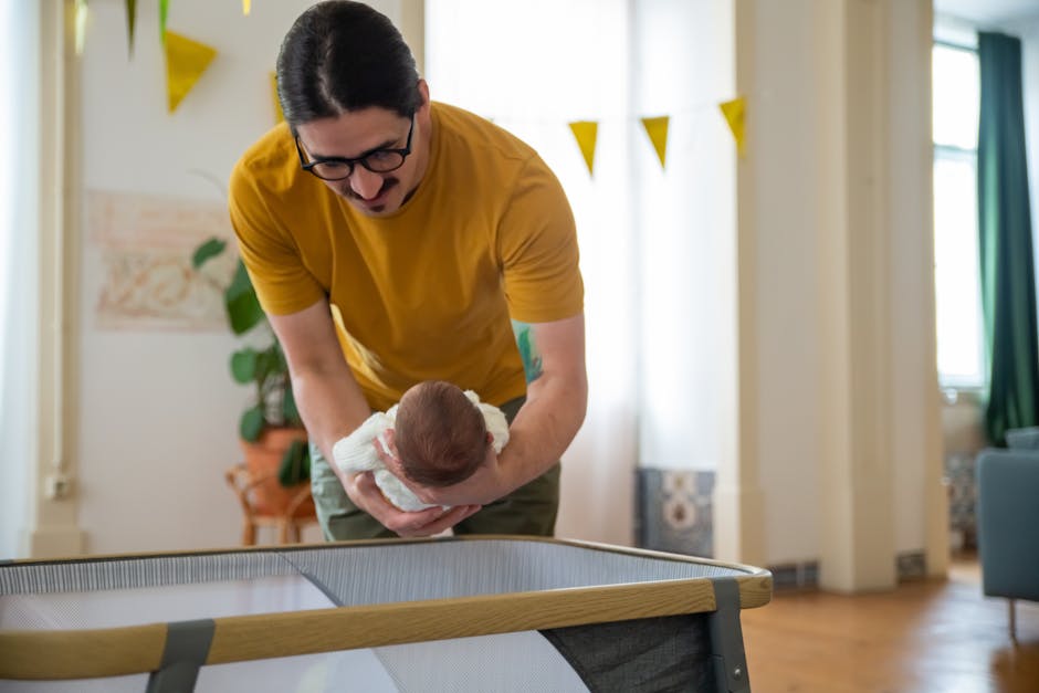 A loving father cradles his newborn in a cozy home setting, showcasing affection and family warmth.